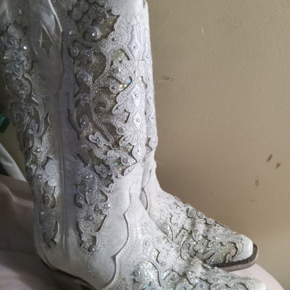 Womens cowboy boots . They are silver with being bling